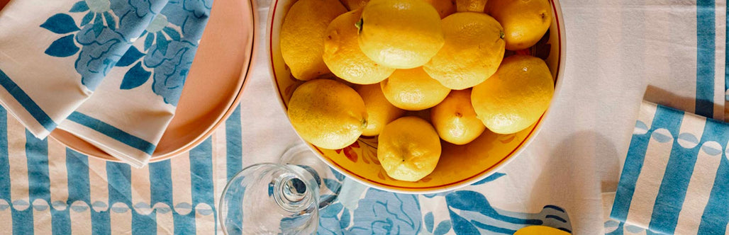 Molly Mahon block print tablecloths, napkins and tbale runners in her new collection 'Neapolitan' featuring Peonies, and her signature geometric print Luna in pastels and blues.
