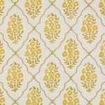 A close-up of a repeating fabric pattern featuring yellow floral bouquets enclosed in gold trellis ovals on a warm off-white background.