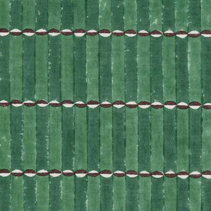 A close-up of a green striped fabric pattern with horizontal rows of small white and dark red oval accents.