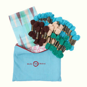 Embroidery kit - floral-pattern in a blue bag with 'Molly Mahon' branding.